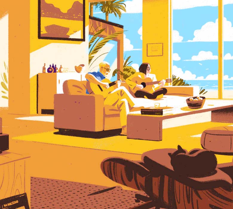 An older couple play their guitars together as they sit on a couch in their spacious living room while a cat sleeps on a chair.